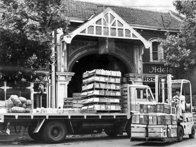 Another photo taken in 1976 -- Trucks unloading outside the market.