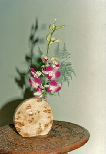 Photo - A simple personal display<br>
featuring a Turned Wooden
 vase made	by Bill